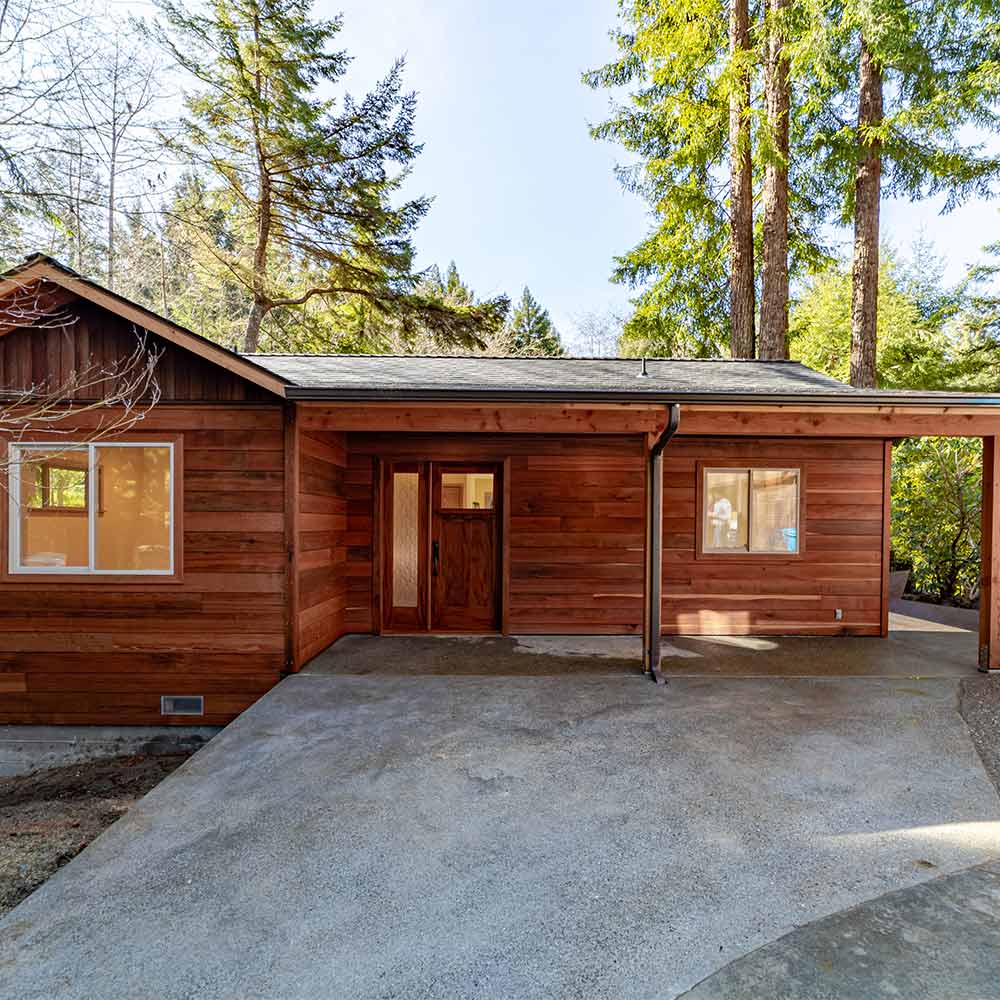 Thomas and Terra’s ADU with a covered porch and driveway.